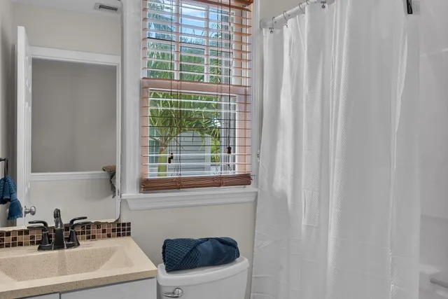 a bathroom with a sink and a window