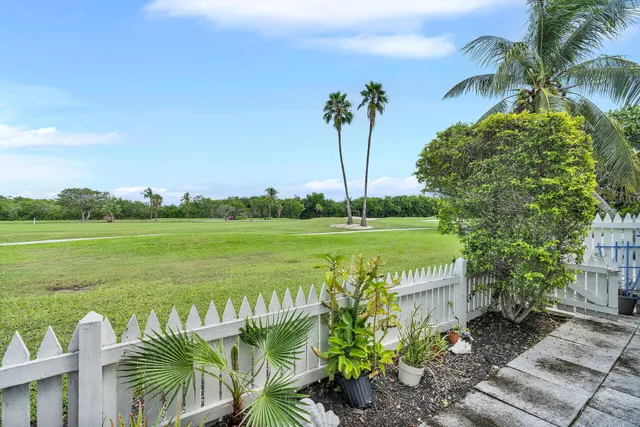 a view of a garden with a table and a chair