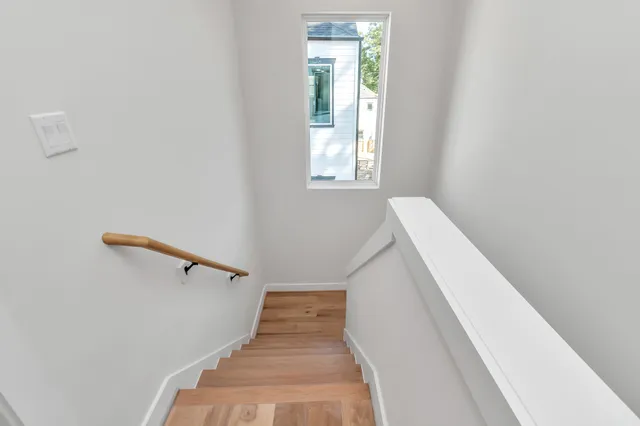 a view of a hallway with windows