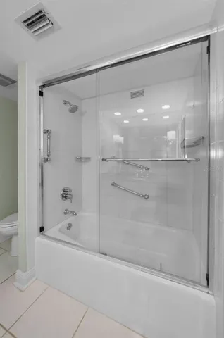 a view of a swimming pool and lounge chairs