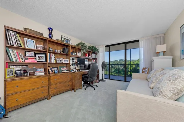 a view of a garden with a building in the background