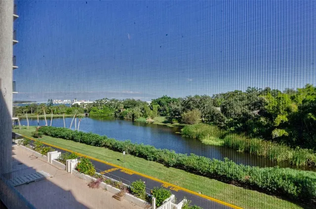 a view of a lake with tall building
