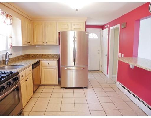 180 Mill Road Chelmsford, MA 01824 - Photo 12 of 30 a kitchen with a stove a refrigerator and cabinets