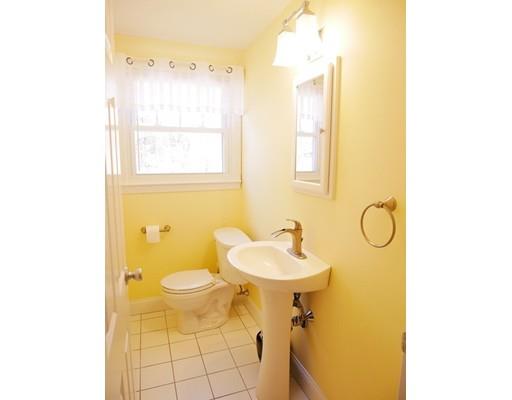 180 Mill Road Chelmsford, MA 01824 - Photo 16 of 30 a bathroom with a sink mirror vanity and toilet