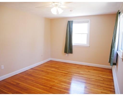 180 Mill Road Chelmsford, MA 01824 - Photo 17 of 30 an empty room with wooden floor and windows