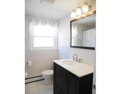 180 Mill Road Chelmsford, MA 01824 - Photo 19 of 30 a bathroom with a sink a toilet and a mirror
