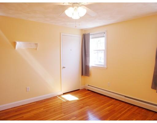 180 Mill Road Chelmsford, MA 01824 - Photo 20 of 30 an empty room with wooden floor and windows