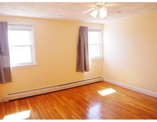 180 Mill Road Chelmsford, MA 01824 - Photo 21 of 30 an empty room with wooden floor and windows
