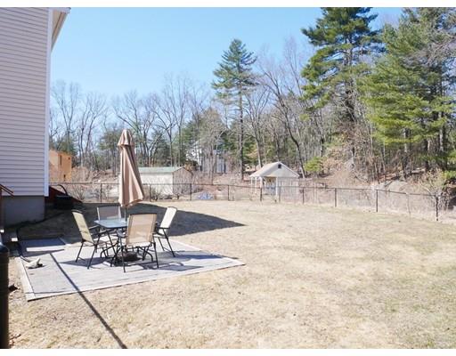 180 Mill Road Chelmsford, MA 01824 - Photo 29 of 30 a view of a patio with table and chairs and potted plants
