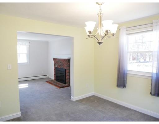 180 Mill Road Chelmsford, MA 01824 - Photo 9 of 30 a view of a livingroom with a chandelier