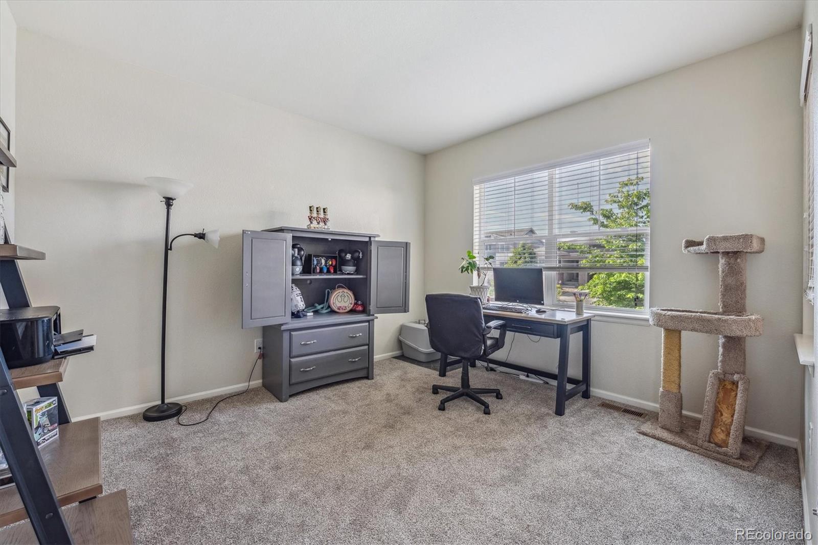19955 West 93rd Avenue Arvada, CO 80007 - Photo 11 of 33 a view of a workspace with furniture and a window
