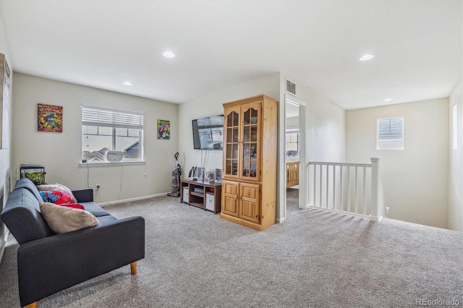 19955 West 93rd Avenue Arvada, CO 80007 - Photo 15 of 33 a living room with furniture and a window