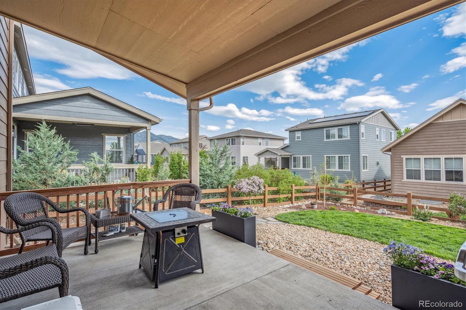 19955 West 93rd Avenue Arvada, CO 80007 - Photo 21 of 33 a view of a patio with table and chairs and potted plants
