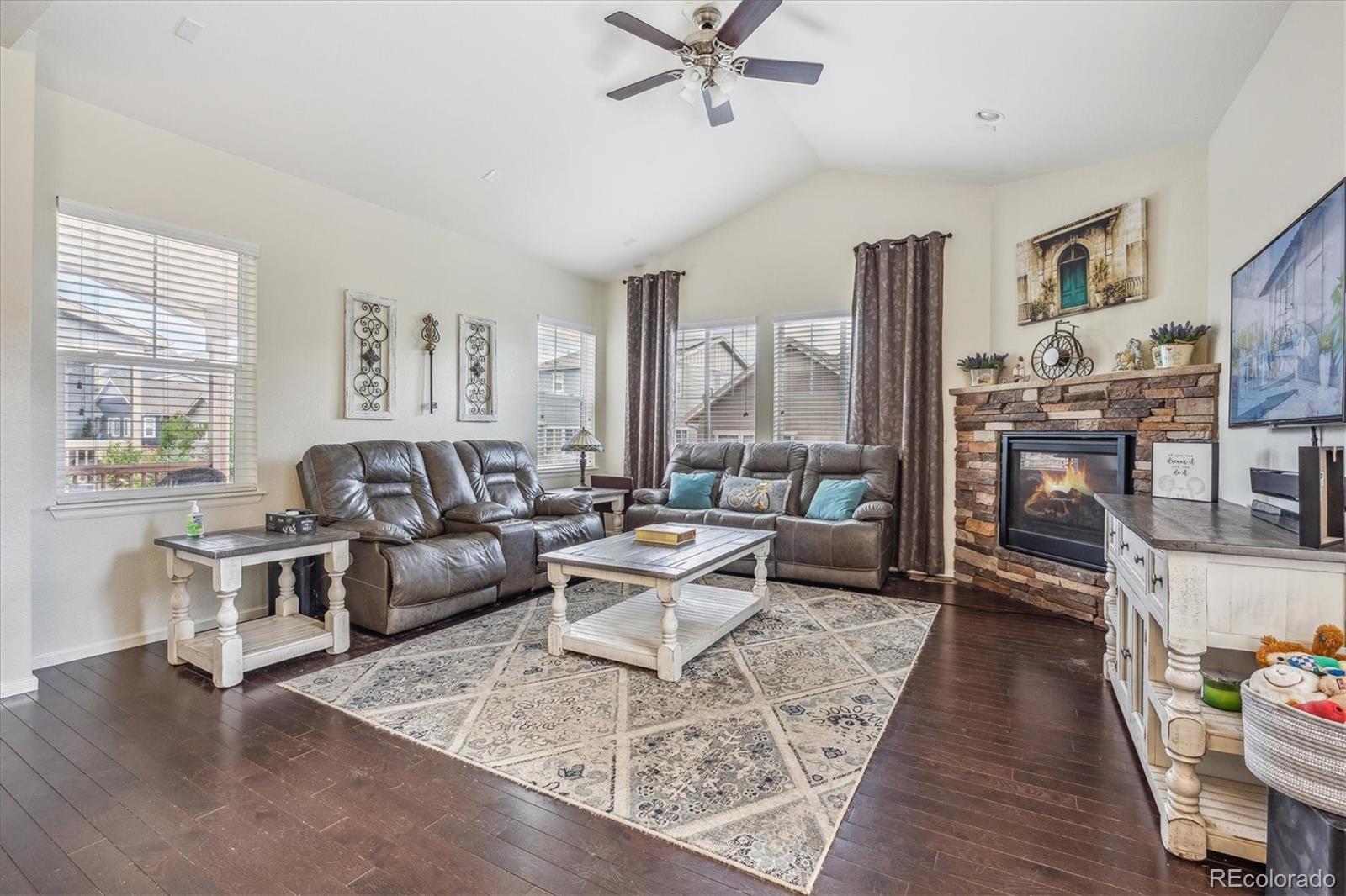 19955 West 93rd Avenue Arvada, CO 80007 - Photo 5 of 33 a living room with furniture and a wooden floor