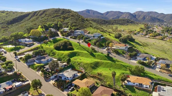 an aerial view of residential houses and outdoor space