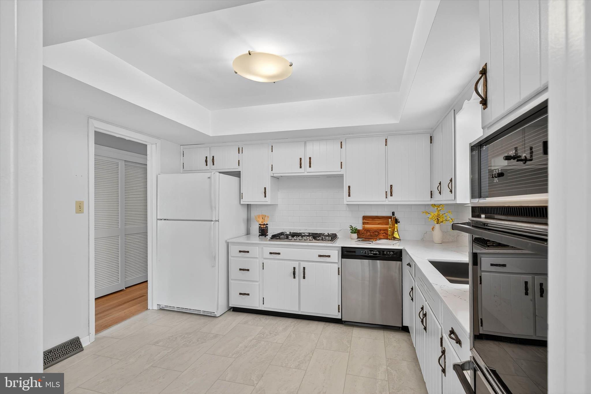 444 Biscayne Road Lancaster, PA 17601 - Photo 11 of 57 a kitchen with white cabinets and white appliances