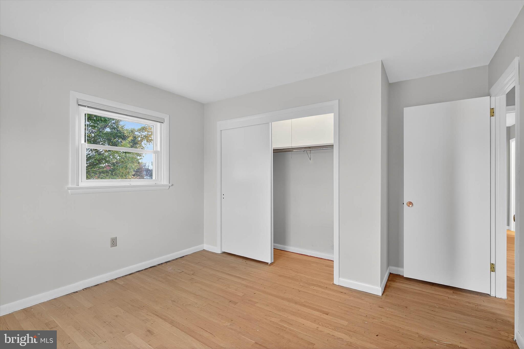 444 Biscayne Road Lancaster, PA 17601 - Photo 23 of 57 a view of an empty room with wooden floor and a window