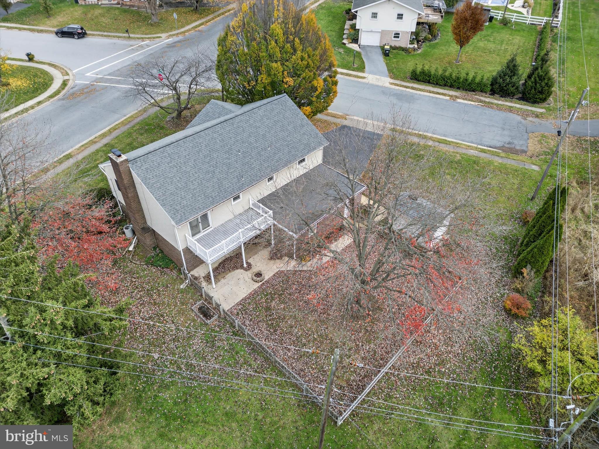 444 Biscayne Road Lancaster, PA 17601 - Photo 52 of 57 an aerial view of a house with swimming pool and large trees