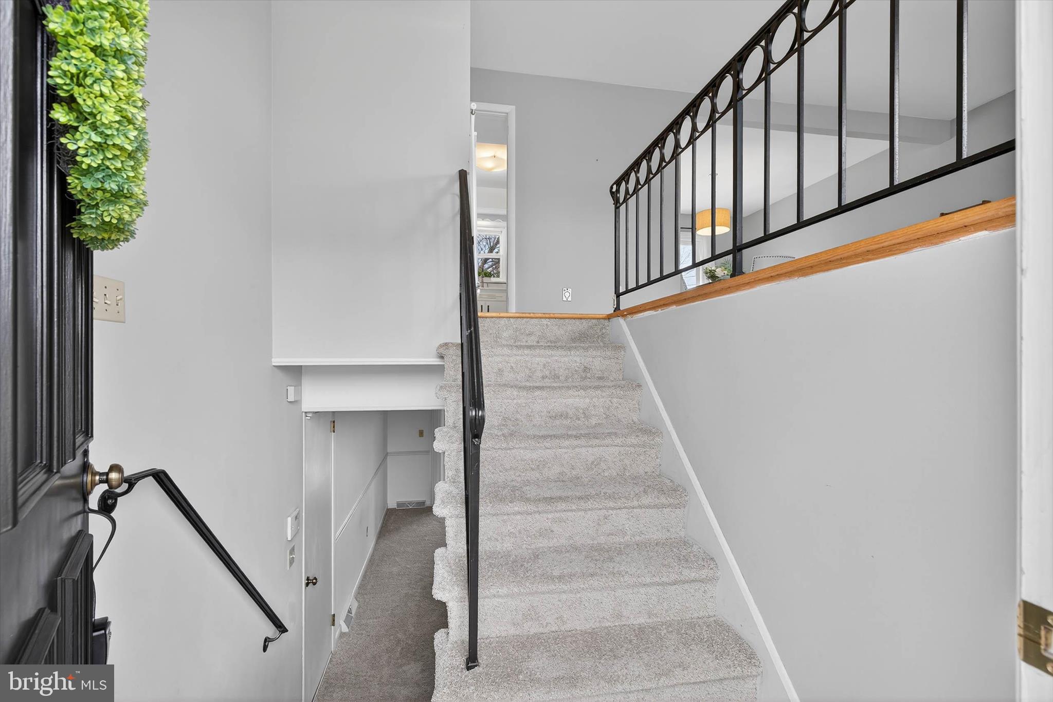 444 Biscayne Road Lancaster, PA 17601 - Photo 7 of 57 a view of staircase with lots of frames on wall and a potted plant