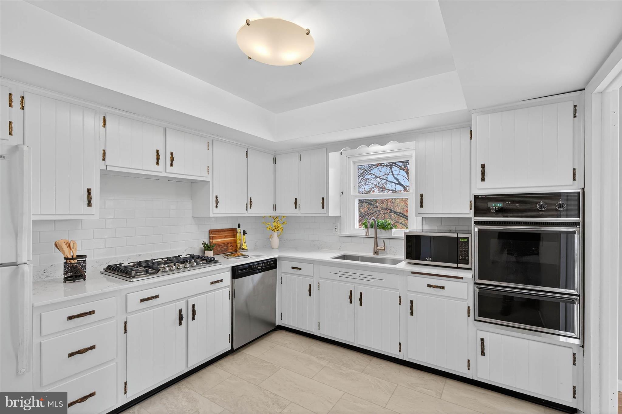 444 Biscayne Road Lancaster, PA 17601 - Photo 10 of 57 a kitchen with white cabinets and white appliances