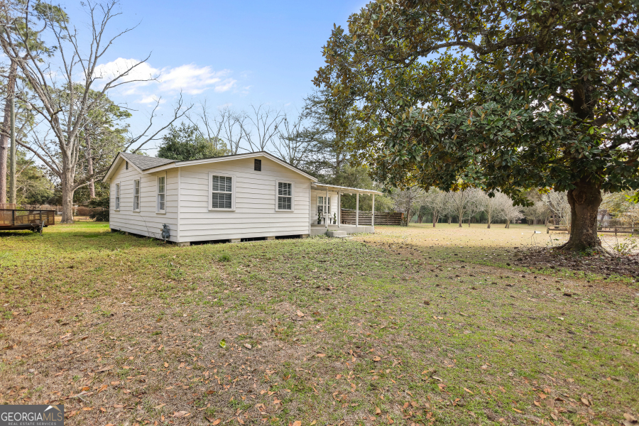 120 Carter Street Jesup, GA 31545 - Photo 22 of 27 a view of a house with a yard