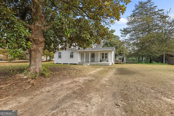 a house with trees in front of it
