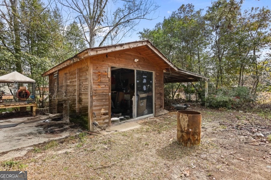 120 Carter Street Jesup, GA 31545 - Photo 25 of 27 a view of house with backyard space and porch