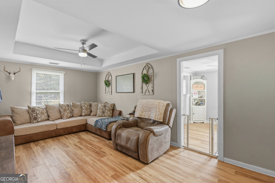120 Carter Street Jesup, GA 31545 - Photo 5 of 27 a living room with furniture and a window
