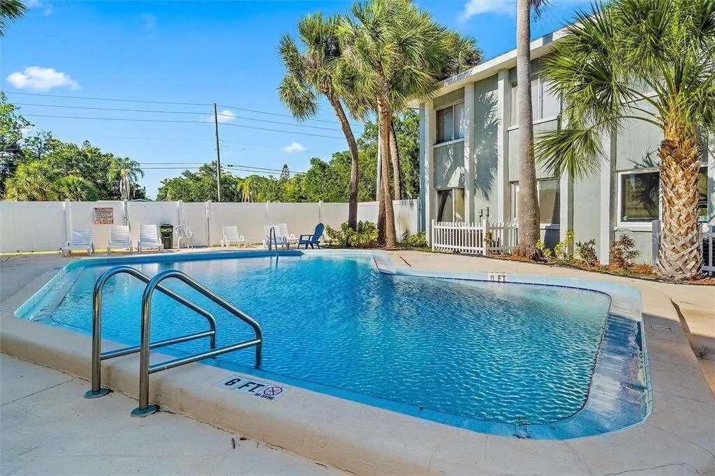 379 47th Avenue North, Unit 103 St. Petersburg, FL 33703 - Photo 1 of 24 a view of swimming pool with a backyard