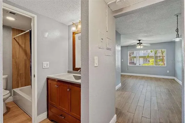 a view of an entryway with wooden floor