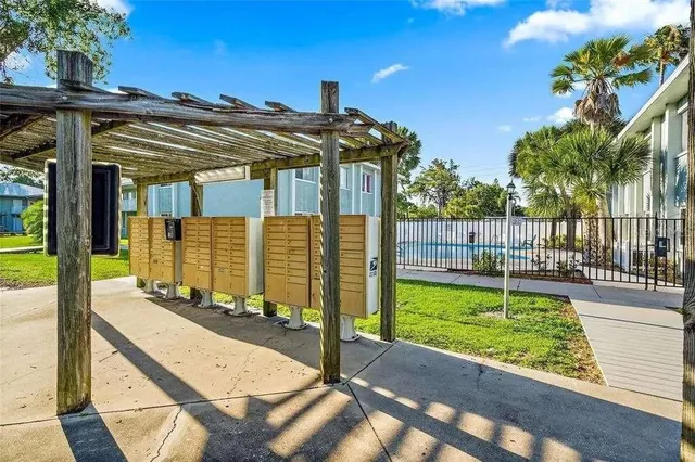 a view of a patio with a table and chairs