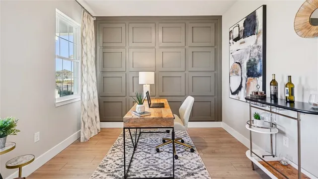 a living room with furniture a rug and a window