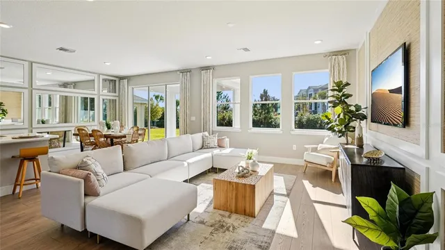 a living room with fireplace furniture and a flat screen tv