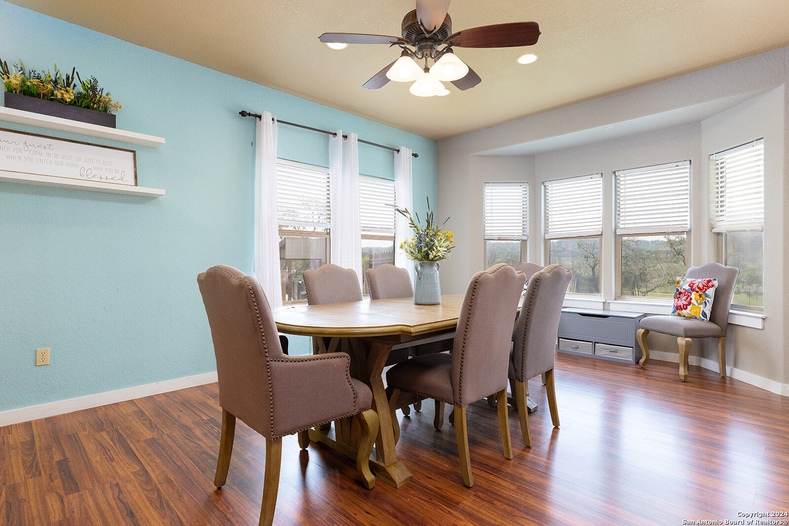 140 Twin Springs Road North Kerrville, TX 78028 - Photo 13 of 47 a view of a dining room with furniture window and wooden floor