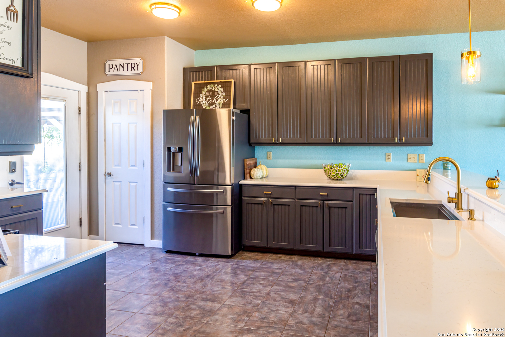 140 Twin Springs Road North Kerrville, TX 78028 - Photo 15 of 47 a kitchen with stainless steel appliances granite countertop a refrigerator and a sink