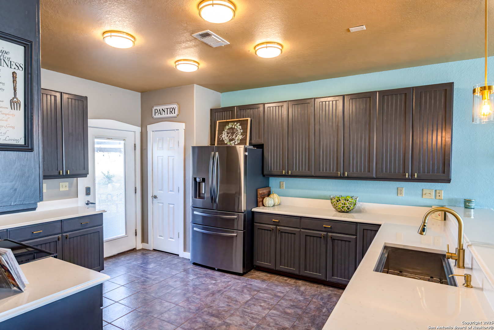 140 Twin Springs Road North Kerrville, TX 78028 - Photo 16 of 47 a kitchen that has a sink cabinets counter space and stainless steel appliances