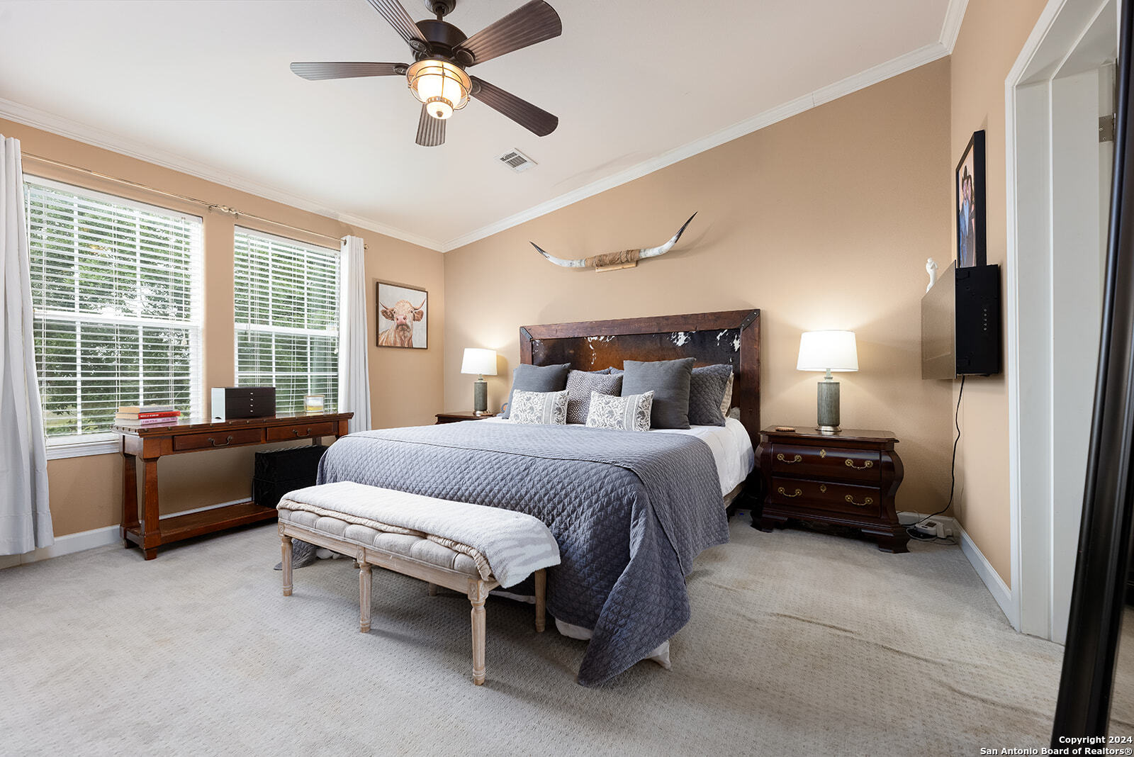 140 Twin Springs Road North Kerrville, TX 78028 - Photo 17 of 47 a bedroom with a bed and a couch