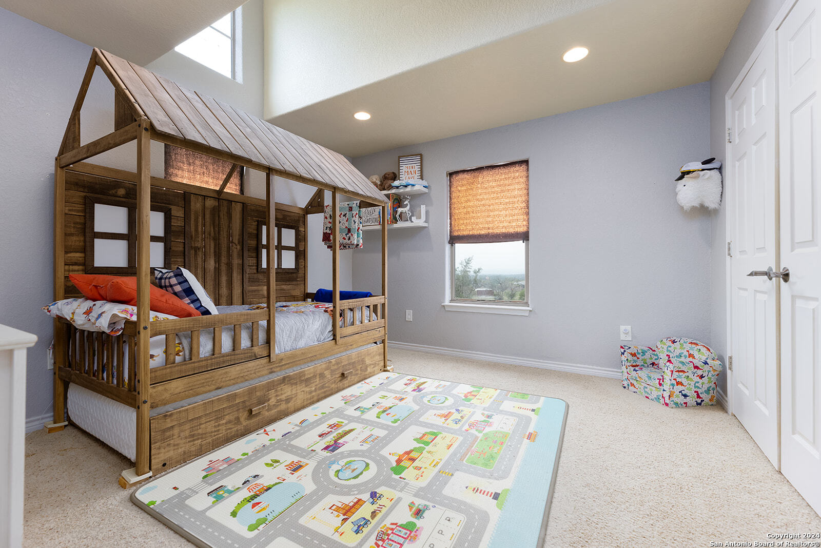 140 Twin Springs Road North Kerrville, TX 78028 - Photo 21 of 47 a bedroom with furniture and a window