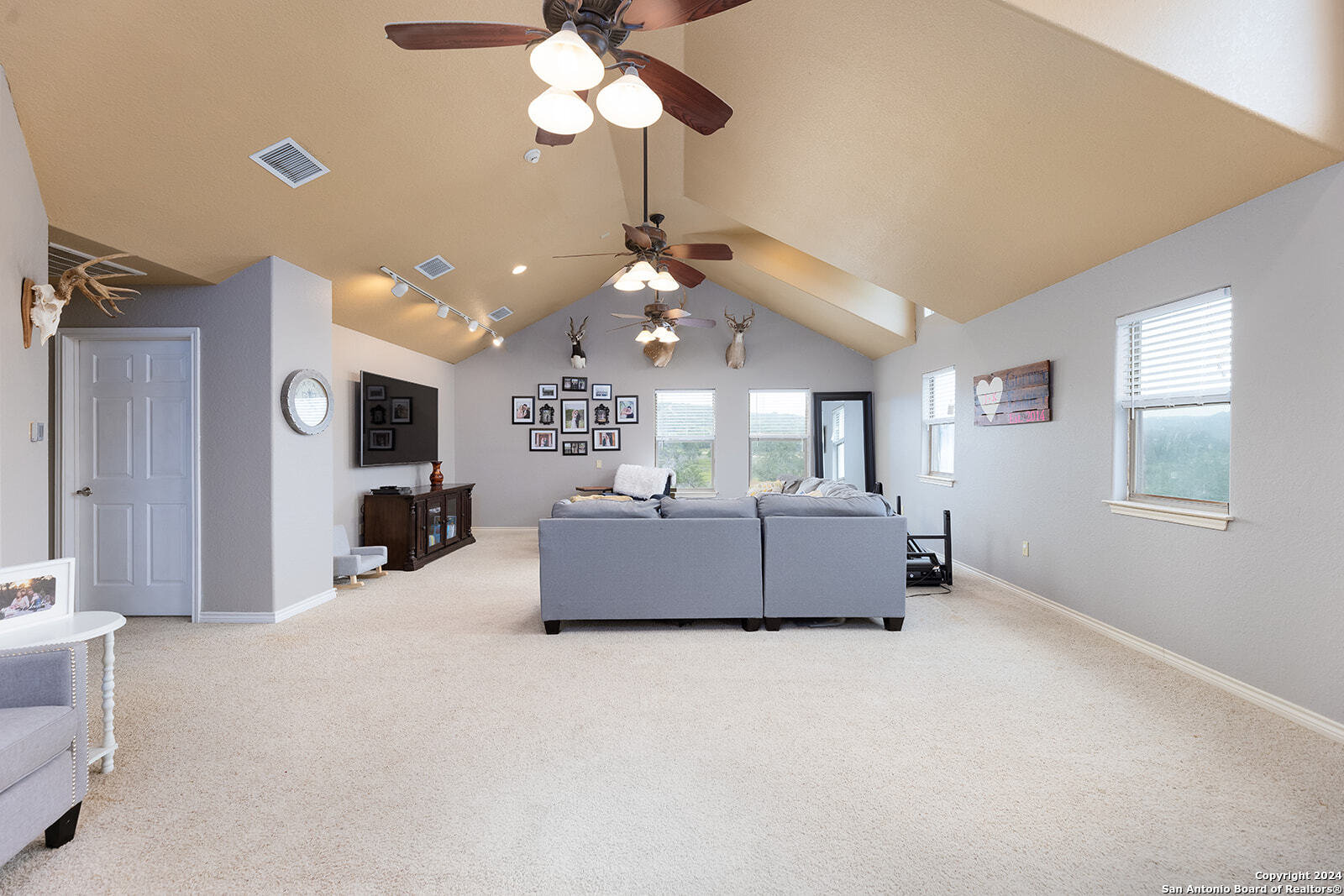 140 Twin Springs Road North Kerrville, TX 78028 - Photo 23 of 47 a living room with furniture and a flat screen tv