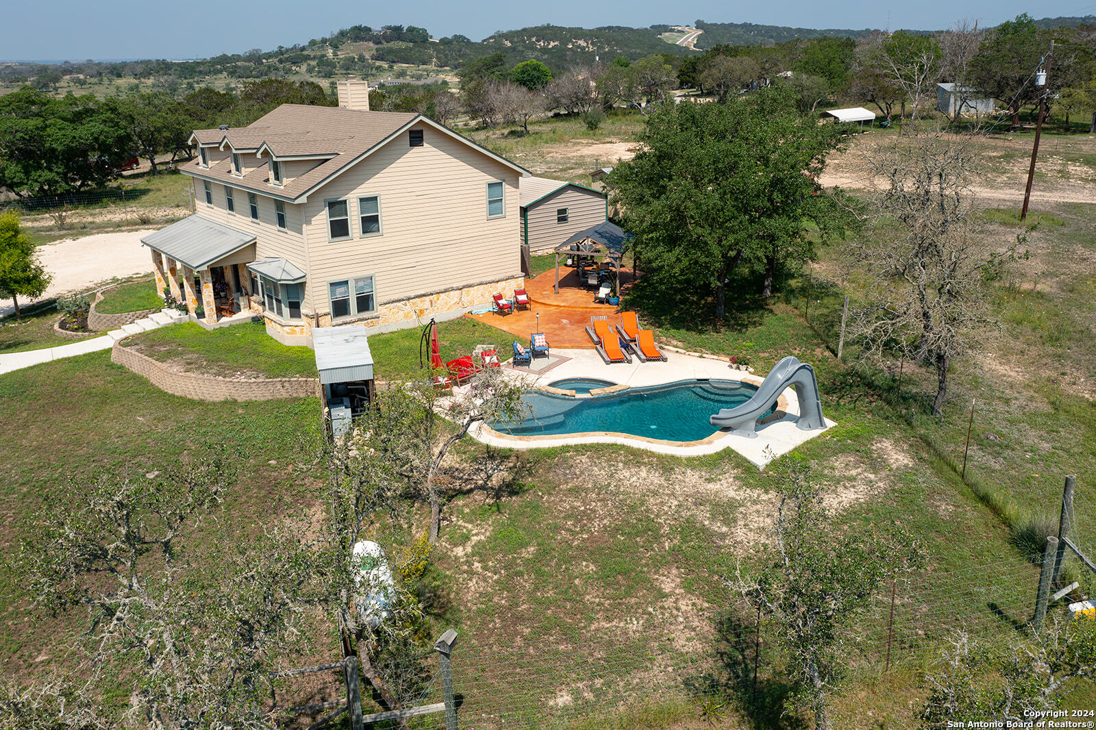 140 Twin Springs Road North Kerrville, TX 78028 - Photo 4 of 47 an aerial view of residential houses with outdoor space and trees