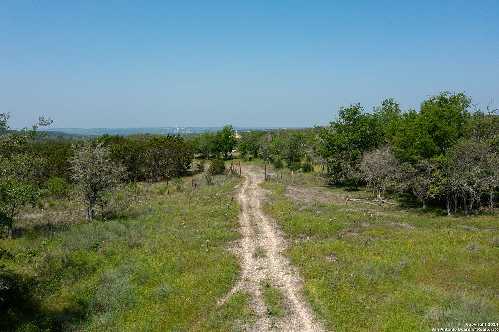 140 Twin Springs Road North Kerrville, TX 78028 - Photo 10 of 47 a view of a grassy area with trees