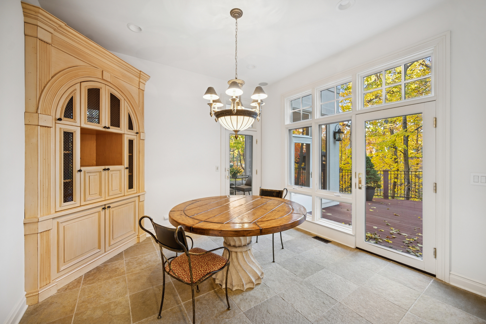 130 Maple Hill Road Glencoe, IL 60022 - Photo 12 of 47 a dining room with furniture a chandelier and window