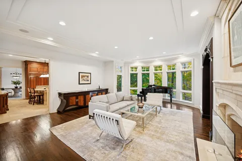 a living room with furniture a fireplace and a table