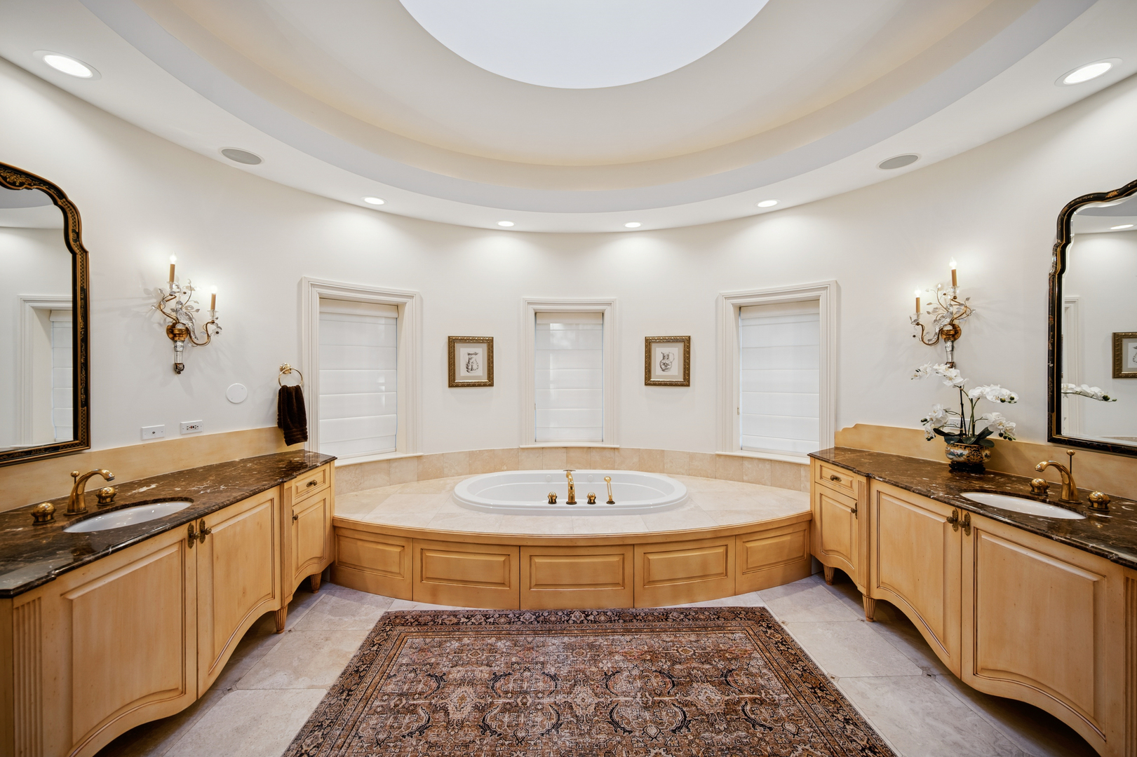 130 Maple Hill Road Glencoe, IL 60022 - Photo 23 of 47 a spacious bathroom with a tub double sink and mirror