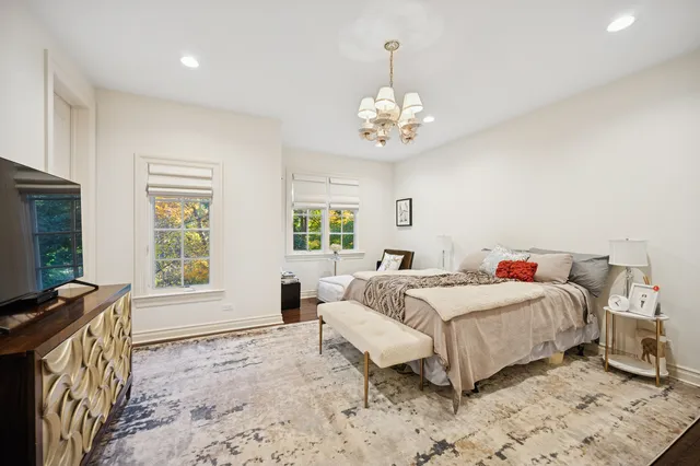 a bedroom with furniture and a window