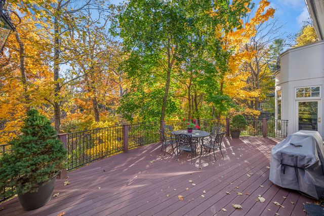 a view of a patio with table and chairs and potted plants
