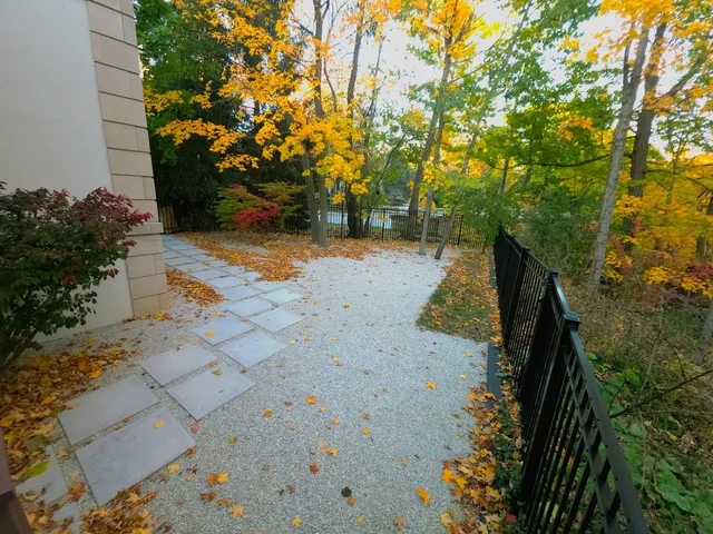 a view of a house with potted plants
