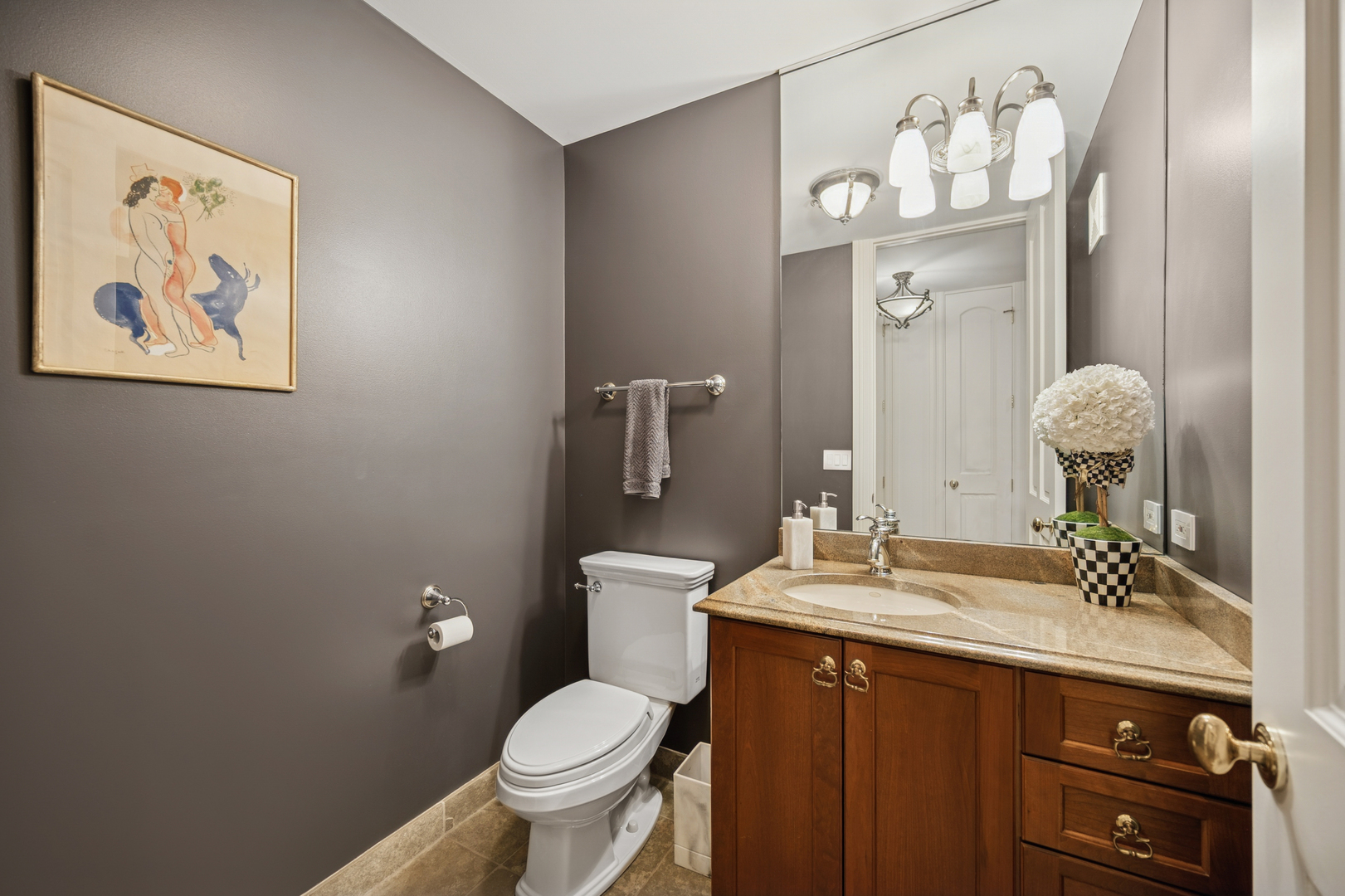 130 Maple Hill Road Glencoe, IL 60022 - Photo 8 of 47 a bathroom with a toilet sink vanity granite and mirror