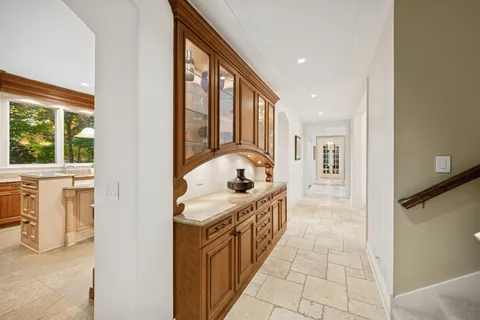 a large kitchen with a table and chairs