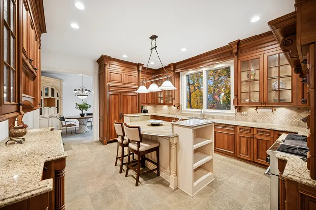 a open kitchen with stainless steel appliances granite countertop a stove and a sink